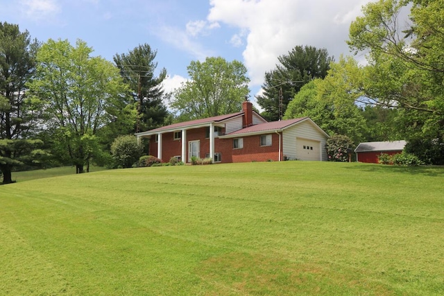 1294 Kings Corners Rd E, Mansfield, OH 44904 - view of front of property with a chimney, a garage, a front lawn, and brick siding