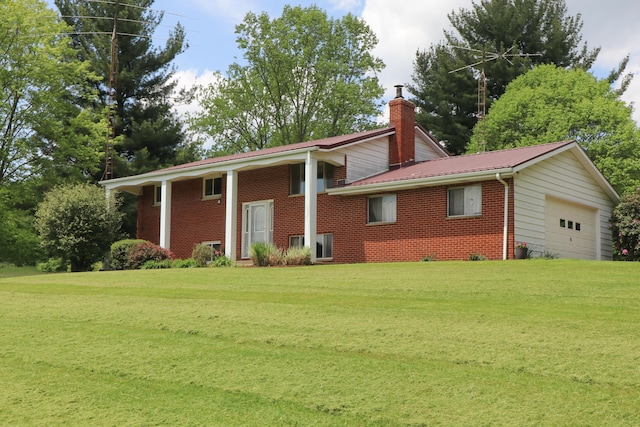 1294 Kings Corners Rd E, Mansfield, OH 44904 - view of front of property featuring brick siding, a front lawn, metal roof, and a chimney