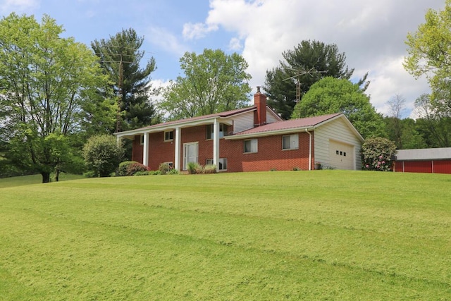 1294 Kings Corners Rd E, Mansfield, OH 44904 - bi-level home with brick siding, a garage, a front yard, and a chimney