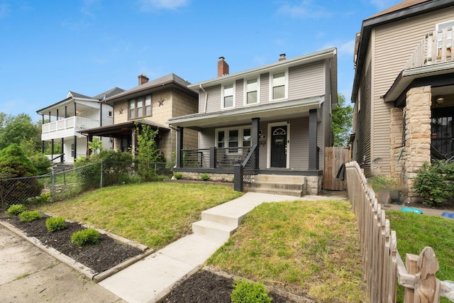view of front of property with a porch and a chimney
