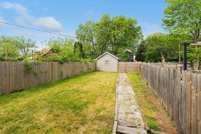view of yard with an outbuilding and a storage unit