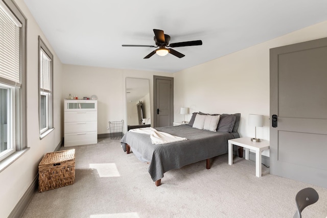 carpeted bedroom featuring a ceiling fan