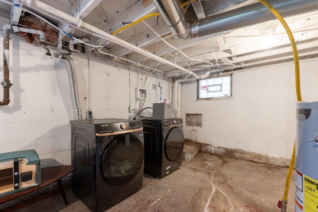 basement with washing machine and clothes dryer and gas water heater