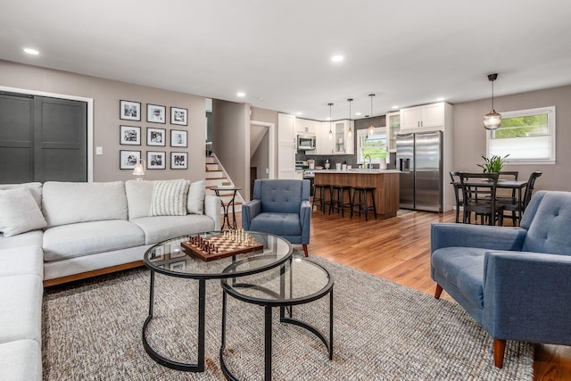 363 Cheyenne Dr, Westerville, OH 43081 - living room featuring light wood-style floors, recessed lighting, and stairs