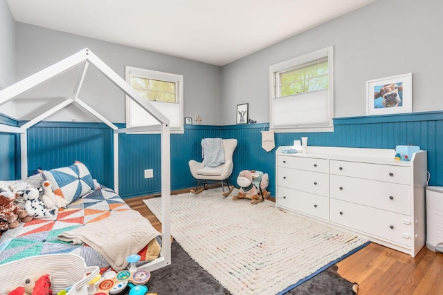 363 Cheyenne Dr, Westerville, OH 43081 - bedroom featuring a wainscoted wall, wood finished floors, and multiple windows