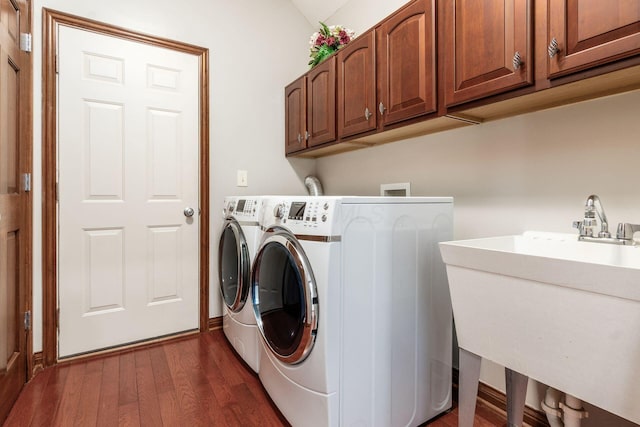 6923 Bishops Crossing Cir, Dublin, OH 43016 - laundry room with cabinet space, washing machine and dryer, and dark wood finished floors