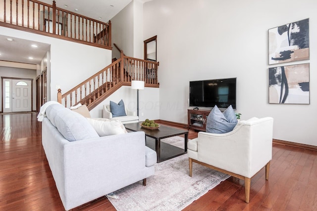 6923 Bishops Crossing Cir, Dublin, OH 43016 - living room featuring stairway, hardwood / wood-style flooring, a high ceiling, and recessed lighting