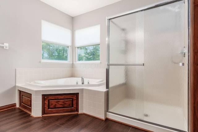 6923 Bishops Crossing Cir, Dublin, OH 43016 - full bathroom with a garden tub, wood finished floors, and a shower stall