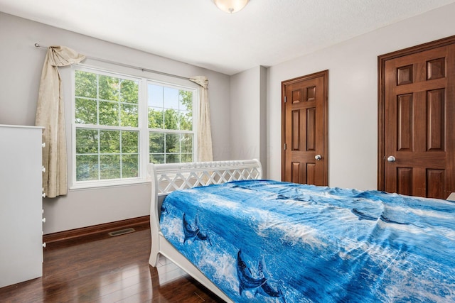 6923 Bishops Crossing Cir, Dublin, OH 43016 - bedroom with wood finished floors and baseboards