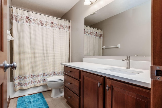 6923 Bishops Crossing Cir, Dublin, OH 43016 - bathroom with vanity, wood finished floors, and shower / tub combo with curtain