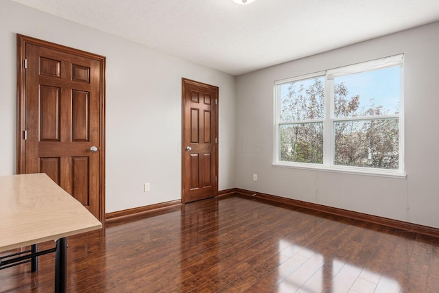 6923 Bishops Crossing Cir, Dublin, OH 43016 - spare room with baseboards and dark wood-type flooring
