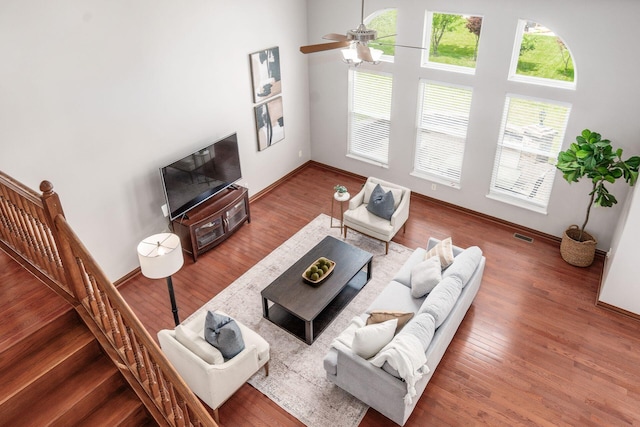6923 Bishops Crossing Cir, Dublin, OH 43016 - living area with wood finished floors, ceiling fan, and stairs