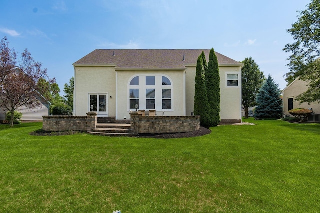 6923 Bishops Crossing Cir, Dublin, OH 43016 - rear view of property with a yard and stucco siding