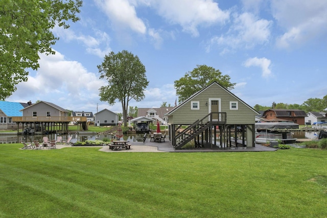 0 Canoe Ln, Thornville, OH 43076 - view of grassy yard with an outdoor fire pit, a patio, a residential view, and a water view