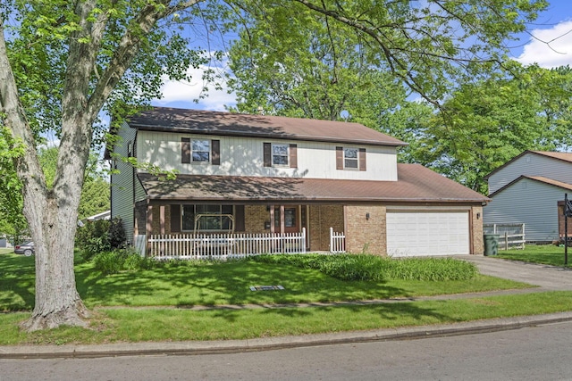 6329 Birkewood St, Columbus, OH 43229 - traditional-style home featuring a porch, driveway, an attached garage, a front lawn, and brick siding