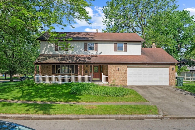 6329 Birkewood St, Columbus, OH 43229 - traditional-style home with asphalt driveway, covered porch, brick siding, a front lawn, and a garage