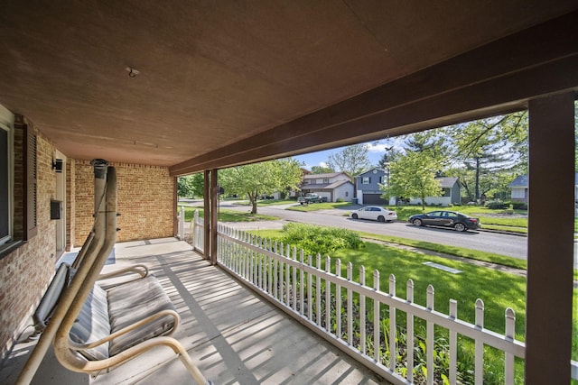 6329 Birkewood St, Columbus, OH 43229 - deck with a residential view, covered porch, and a yard