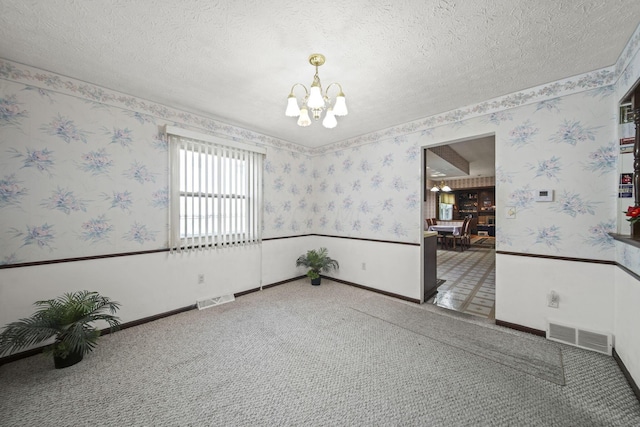 6329 Birkewood St, Columbus, OH 43229 - empty room featuring a chandelier, wallpapered walls, carpet flooring, baseboards, and a textured ceiling