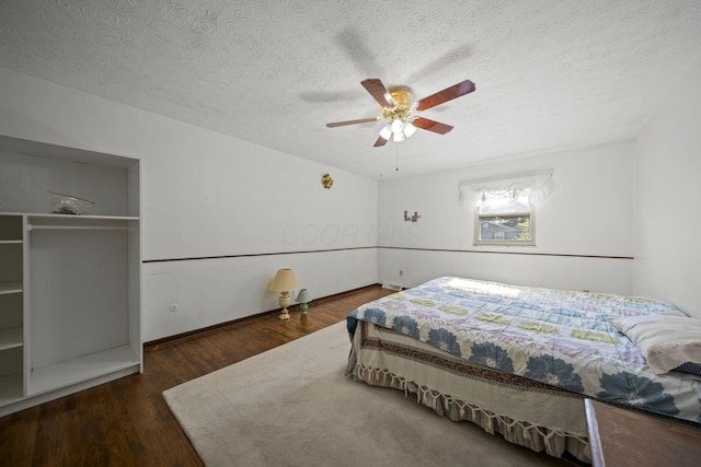 6329 Birkewood St, Columbus, OH 43229 - bedroom with wood finished floors, a textured ceiling, and a ceiling fan