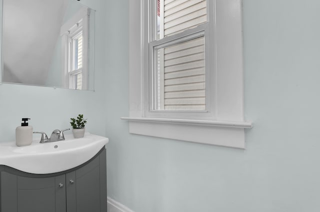 bathroom featuring vanity and baseboards