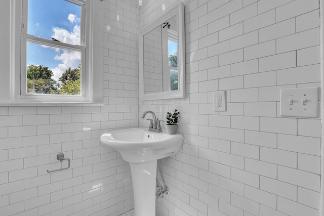 bathroom with tile walls