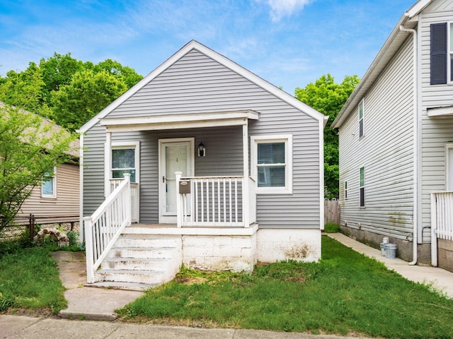 84 Meek Ave, Columbus, OH 43222 - shotgun-style home featuring covered porch