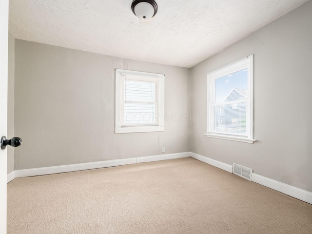 84 Meek Ave, Columbus, OH 43222 - carpeted empty room with baseboards and a textured ceiling