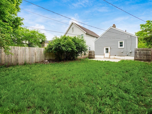 84 Meek Ave, Columbus, OH 43222 - rear view of house featuring a chimney