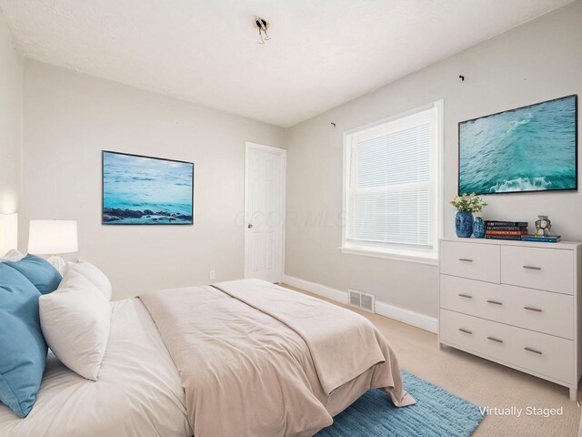 84 Meek Ave, Columbus, OH 43222 - bedroom featuring baseboards and light carpet
