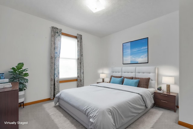 6301 Columbus Rd, Centerburg, OH 43011 - bedroom with baseboards, light carpet, and a textured ceiling