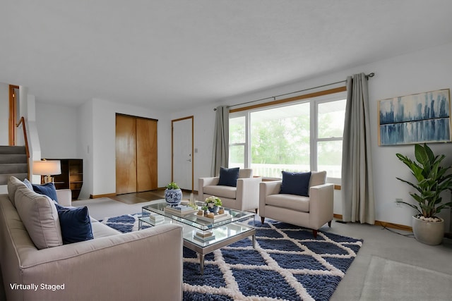 6301 Columbus Rd, Centerburg, OH 43011 - living room with stairway, baseboards, and light carpet
