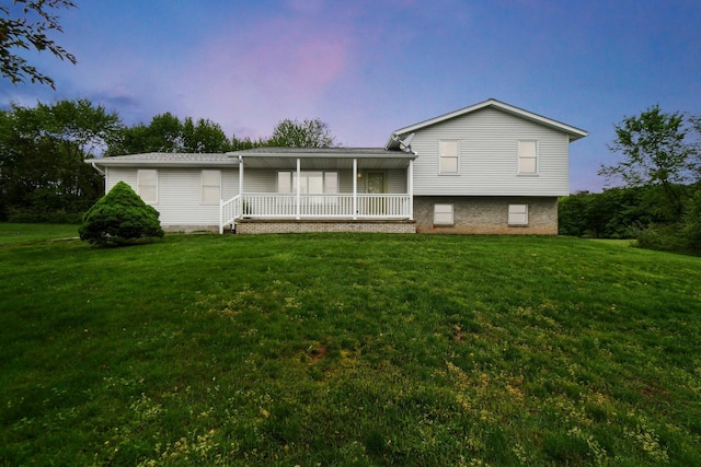 6301 Columbus Rd, Centerburg, OH 43011 - split level home with a front lawn and covered porch