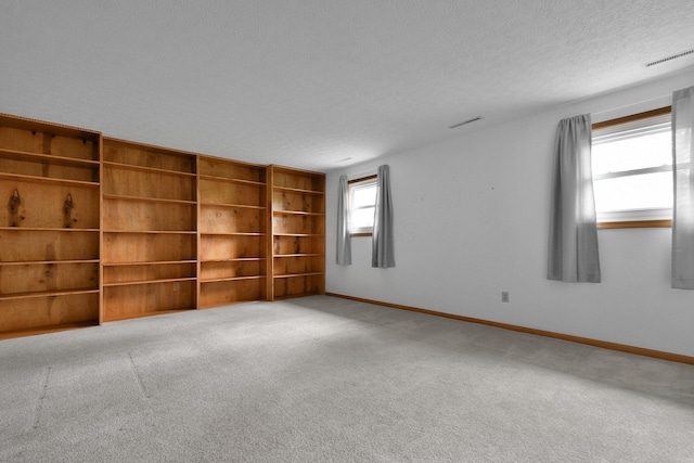 6301 Columbus Rd, Centerburg, OH 43011 - carpeted spare room with a textured ceiling and baseboards