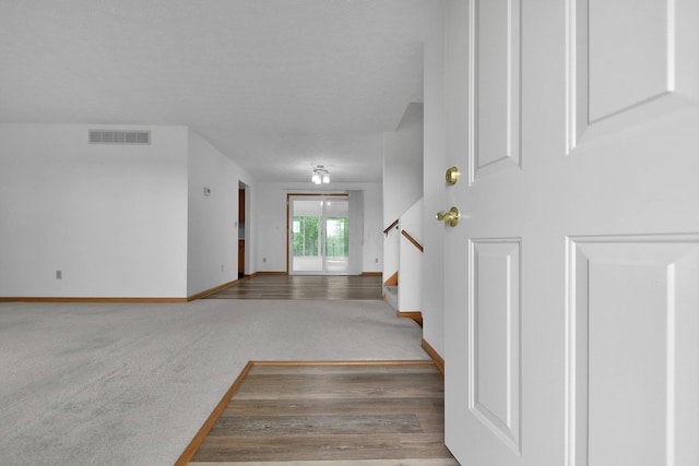 6301 Columbus Rd, Centerburg, OH 43011 - staircase with carpet, baseboards, and wood finished floors