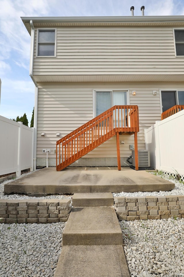 524 Autumn Ridge Cir, Pickerington, OH 43147 - rear view of house featuring central AC unit, fence, and a patio area