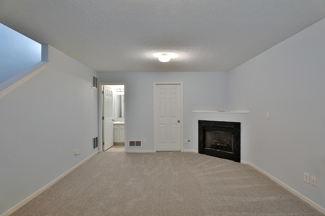 524 Autumn Ridge Cir, Pickerington, OH 43147 - unfurnished living room featuring a fireplace, light colored carpet, baseboards, and a textured ceiling
