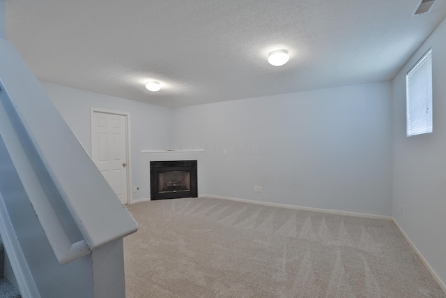 524 Autumn Ridge Cir, Pickerington, OH 43147 - unfurnished living room featuring carpet floors, a fireplace, a textured ceiling, and baseboards