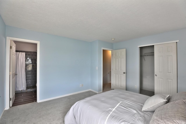 524 Autumn Ridge Cir, Pickerington, OH 43147 - carpeted bedroom featuring baseboards, a closet, a textured ceiling, and ensuite bathroom