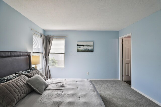 524 Autumn Ridge Cir, Pickerington, OH 43147 - carpeted bedroom featuring baseboards and a textured ceiling