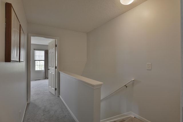 524 Autumn Ridge Cir, Pickerington, OH 43147 - corridor featuring an upstairs landing, light colored carpet, and baseboards