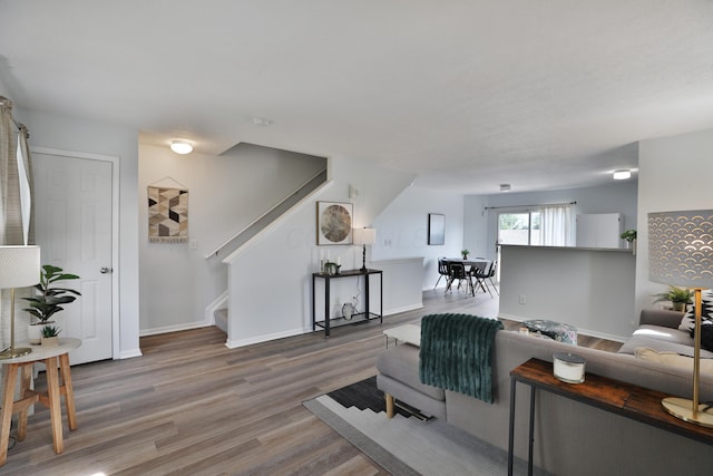 524 Autumn Ridge Cir, Pickerington, OH 43147 - living area featuring stairway, wood finished floors, and baseboards