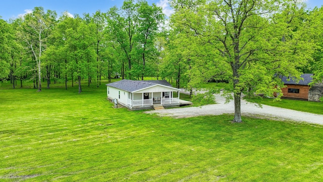 6125 Stafford Rd, Washington Court House, OH 43160 - view of front of house featuring gravel driveway, a front yard, a porch, and roof with shingles