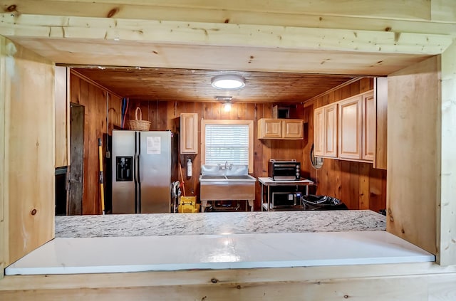 6125 Stafford Rd, Washington Court House, OH 43160 - kitchen with stainless steel fridge, wooden walls, wooden ceiling, a sink, and a peninsula