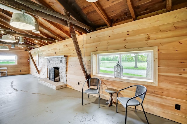 6125 Stafford Rd, Washington Court House, OH 43160 - sitting room with wooden walls, concrete flooring, a stone fireplace, and wood ceiling