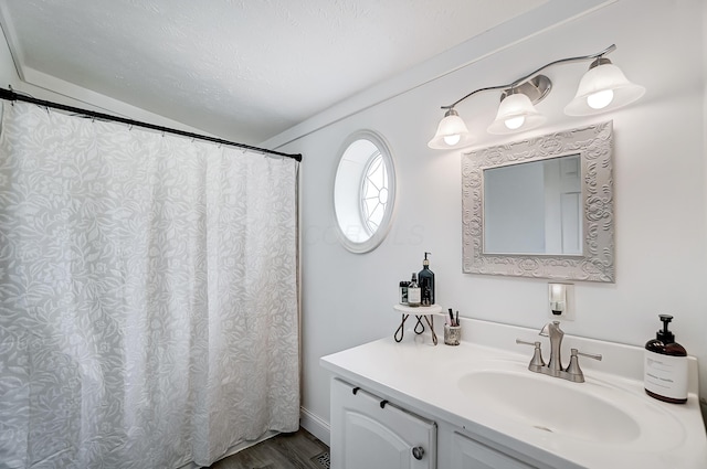 6125 Stafford Rd, Washington Court House, OH 43160 - full bathroom featuring vanity and wood finished floors