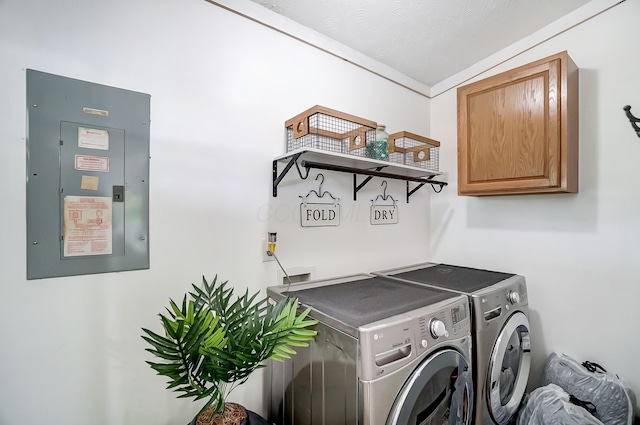 6125 Stafford Rd, Washington Court House, OH 43160 - laundry room featuring washing machine and clothes dryer, cabinet space, and electric panel