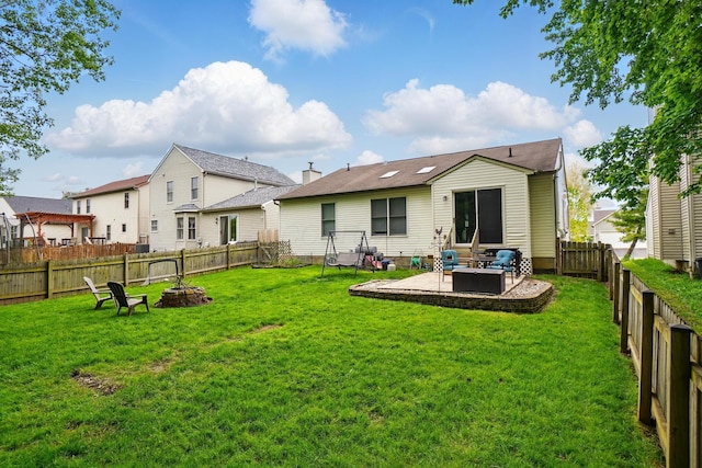 6963 Weurful Dr, Canal Winchester, OH 43110 - back of property with an outdoor fire pit and a patio area