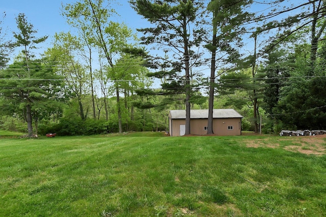 2116 Dunzweiler Dr, Zanesville, OH 43701 - view of grassy yard with an outbuilding and a view of trees