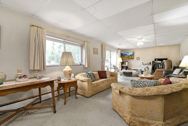 2116 Dunzweiler Dr, Zanesville, OH 43701 - living area with a drop ceiling, light colored carpet, ceiling fan, and a baseboard heating unit