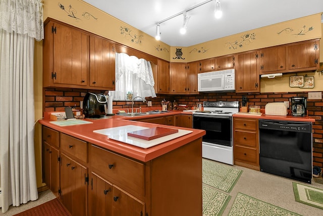 2116 Dunzweiler Dr, Zanesville, OH 43701 - kitchen with white appliances, a sink, a peninsula, brown cabinetry, and backsplash